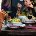 Vegetarian Restaurant. Young Woman In A Vegetarian Restaurant